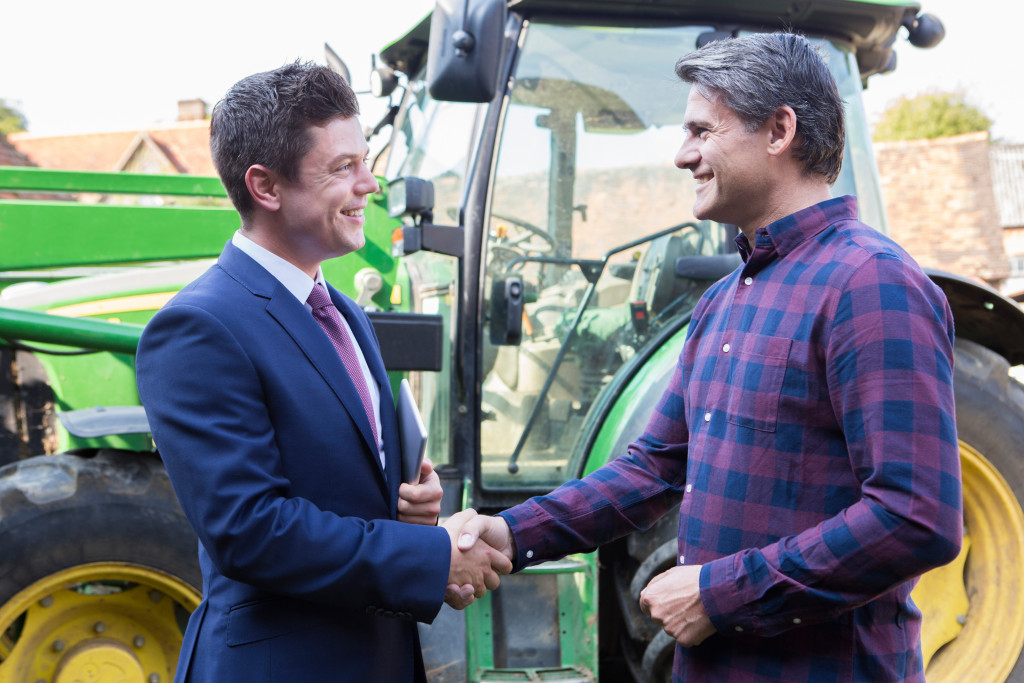 a businessman with a farmer deal