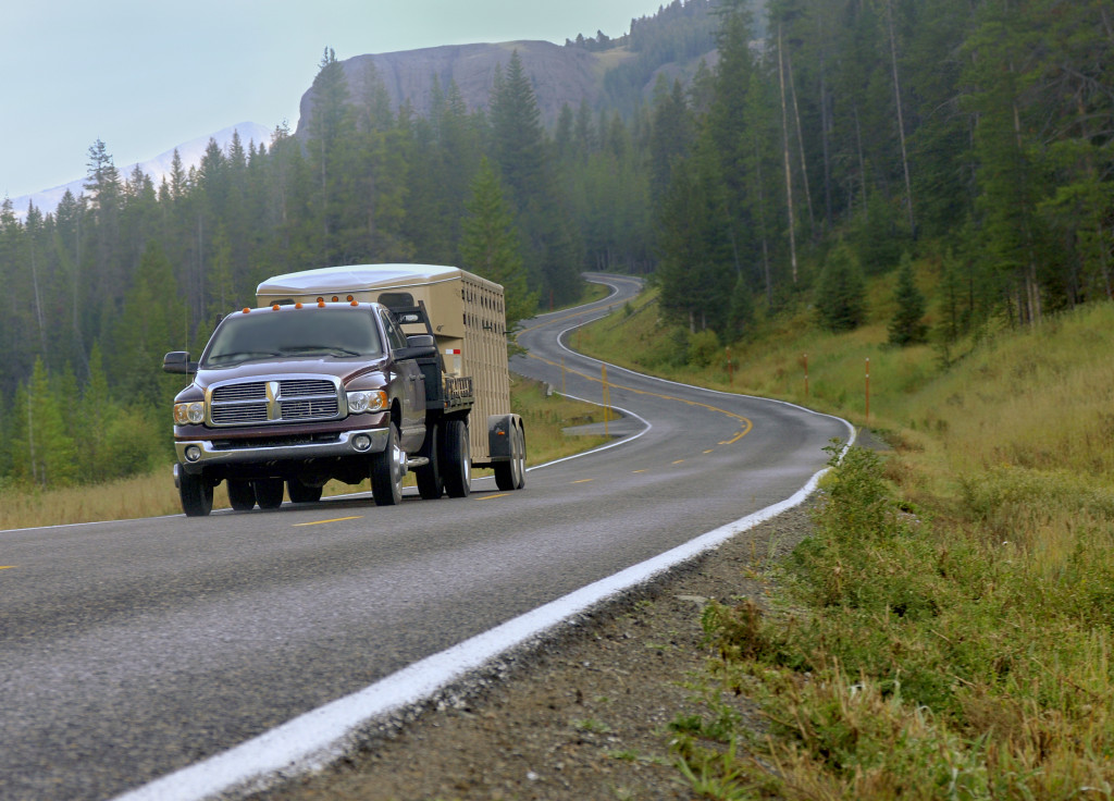 Pickup truck with a camper attached to it.