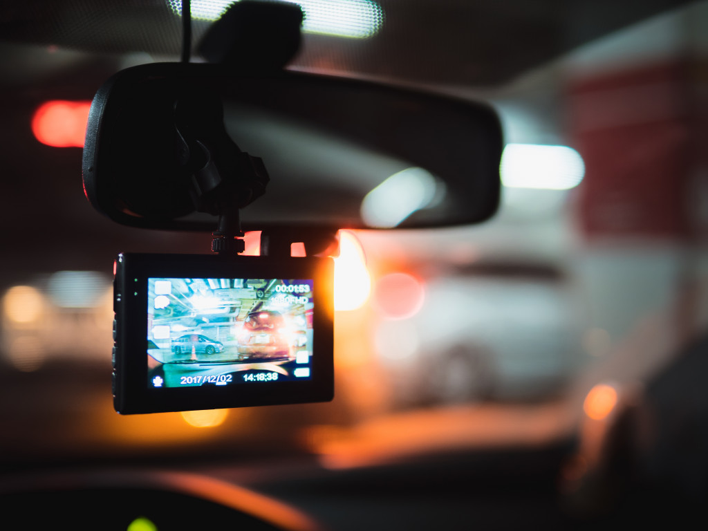 Rear view camera of a car showing car rear view in the screen in a parking lot