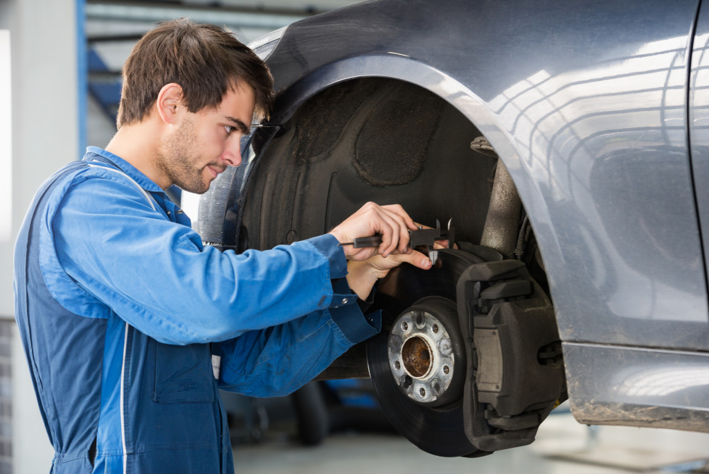 A professional mechanic repairing a tire.