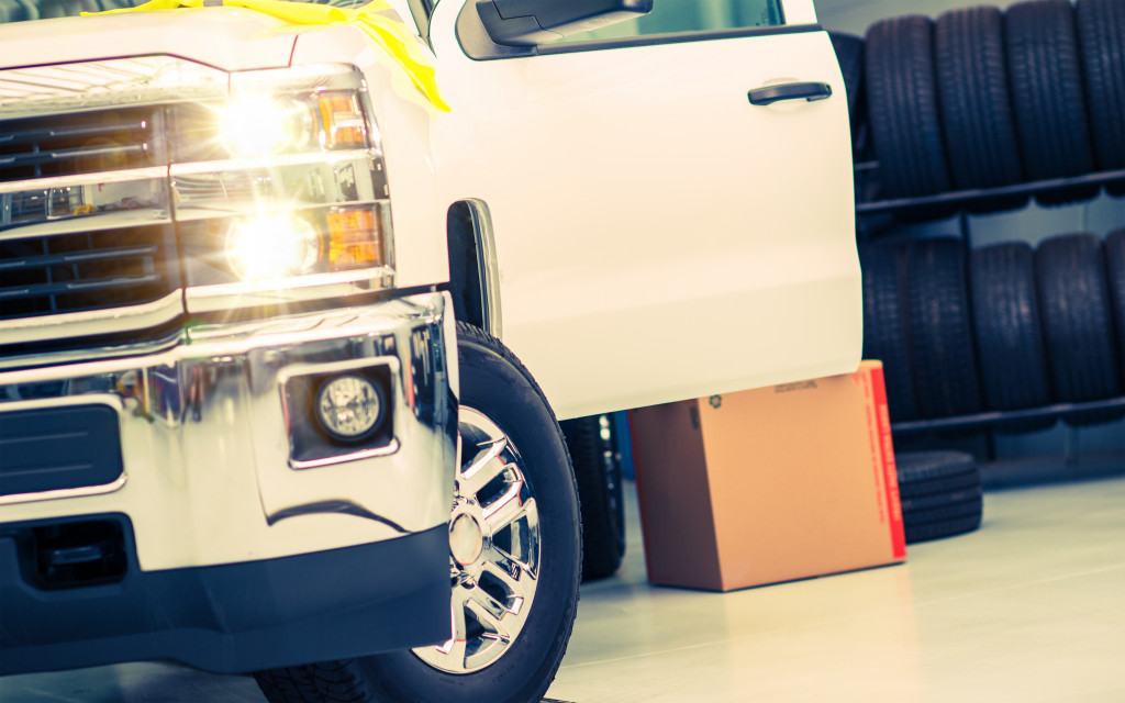 A pickup truck being maintained