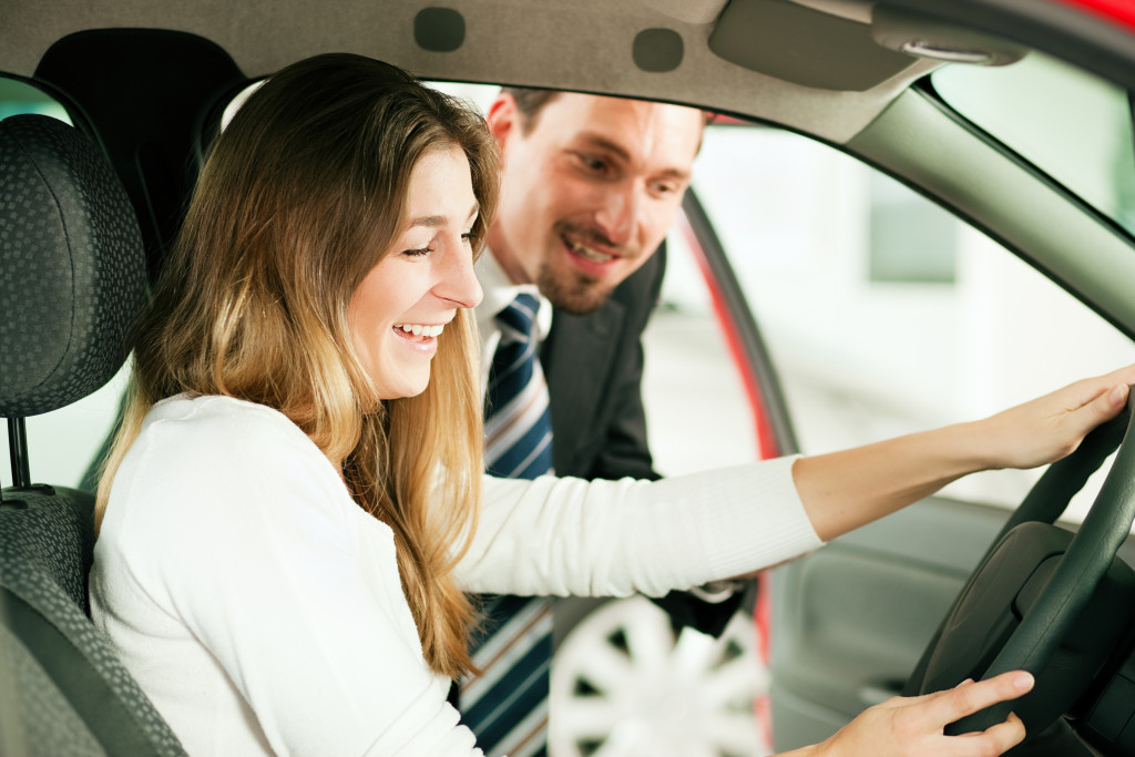 A woman inside her car