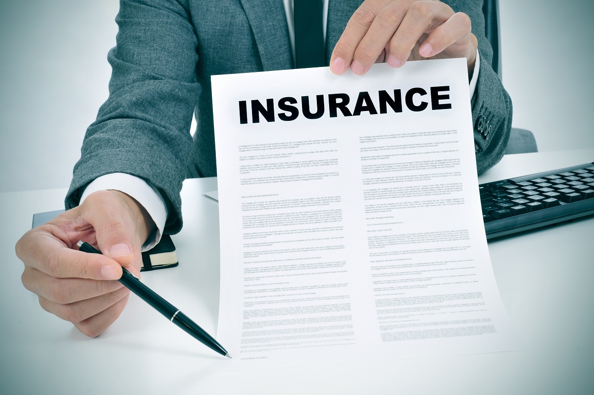 Insurance document with pen